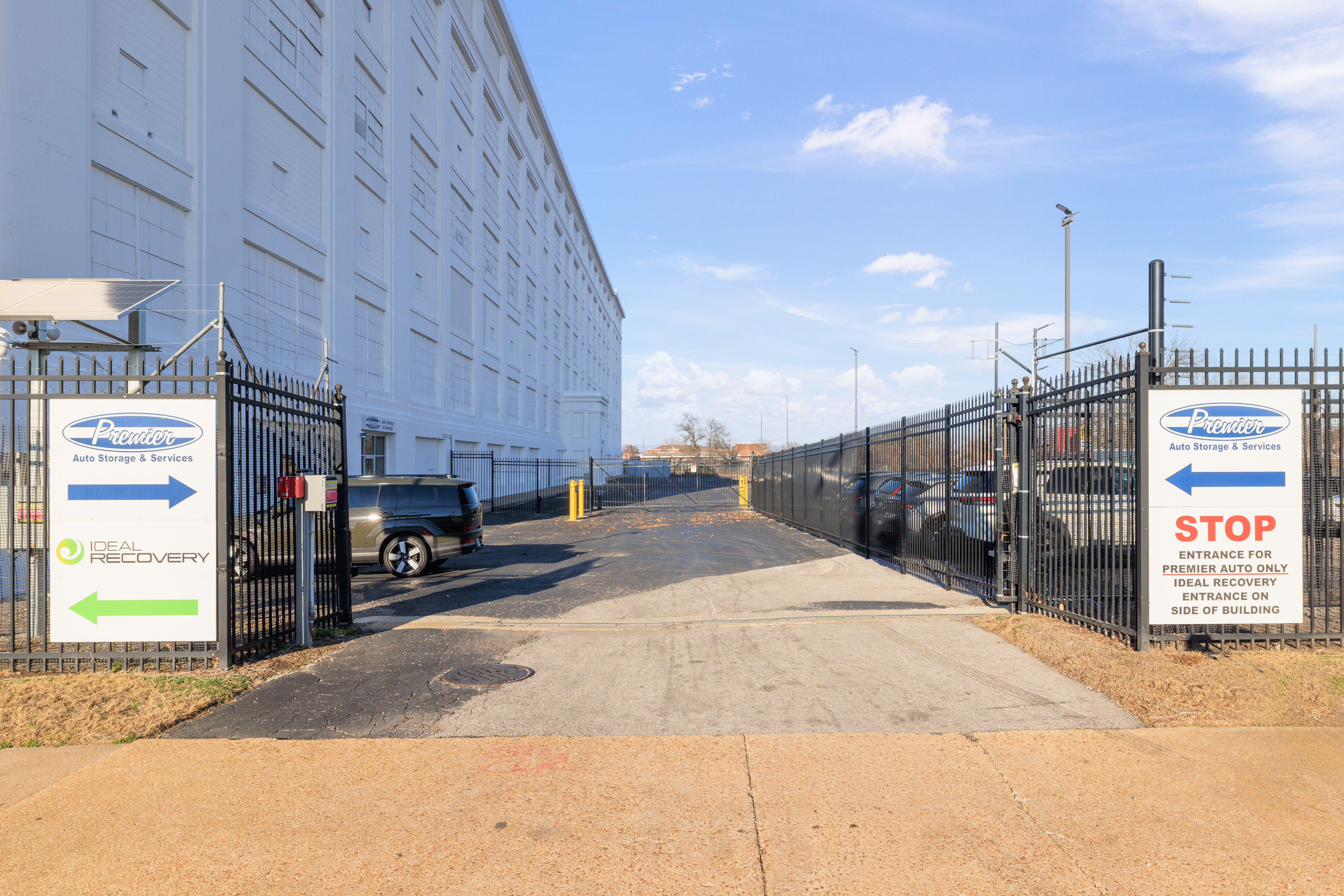 Premier VES gated facility entrance with security signage