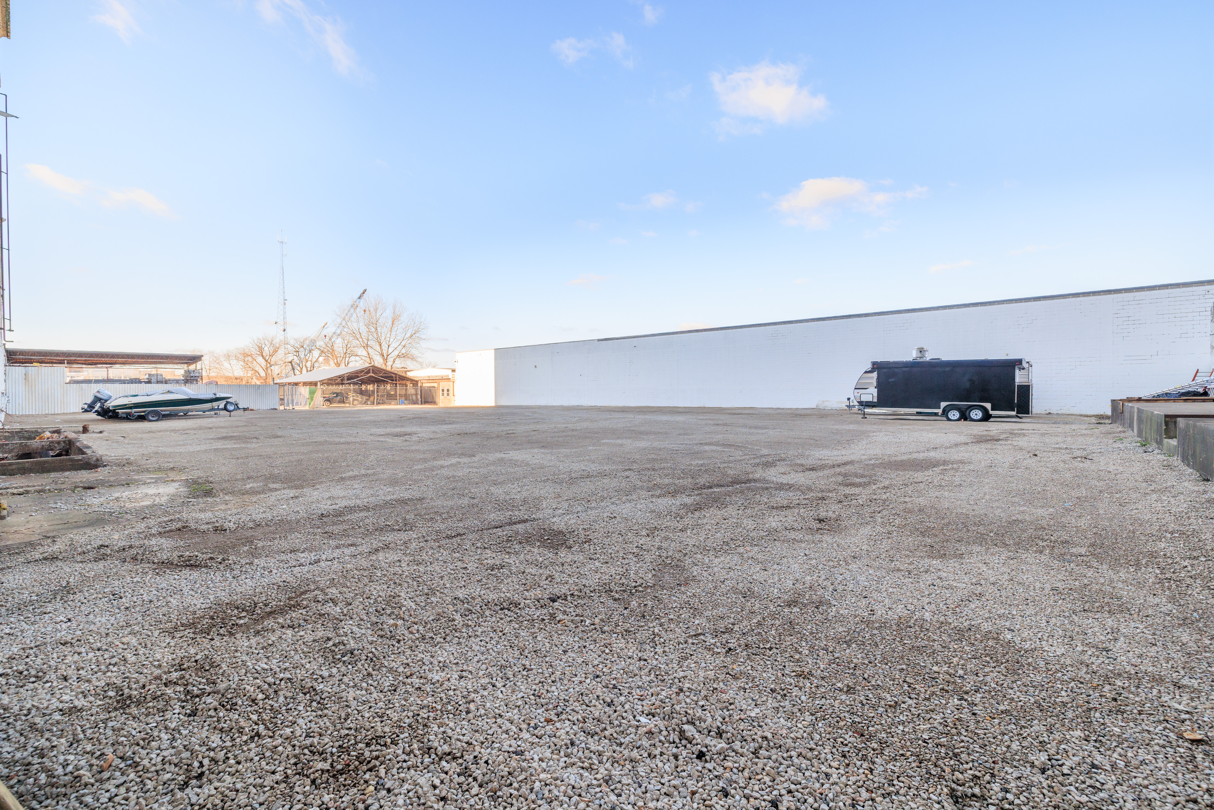 Secured outdoor lot perimeter along facility exterior
