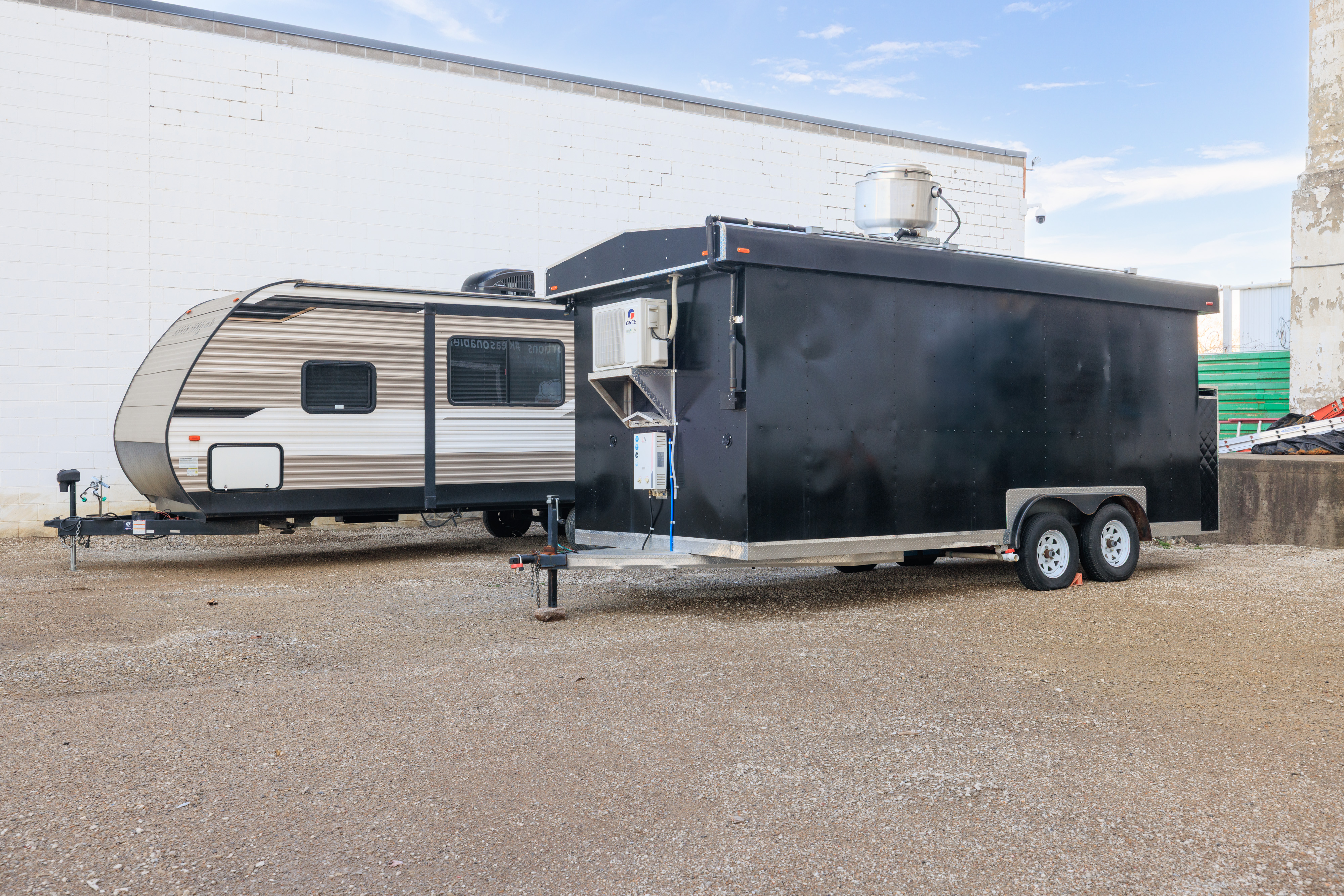 Large commercial trailers stored in outdoor secured lot