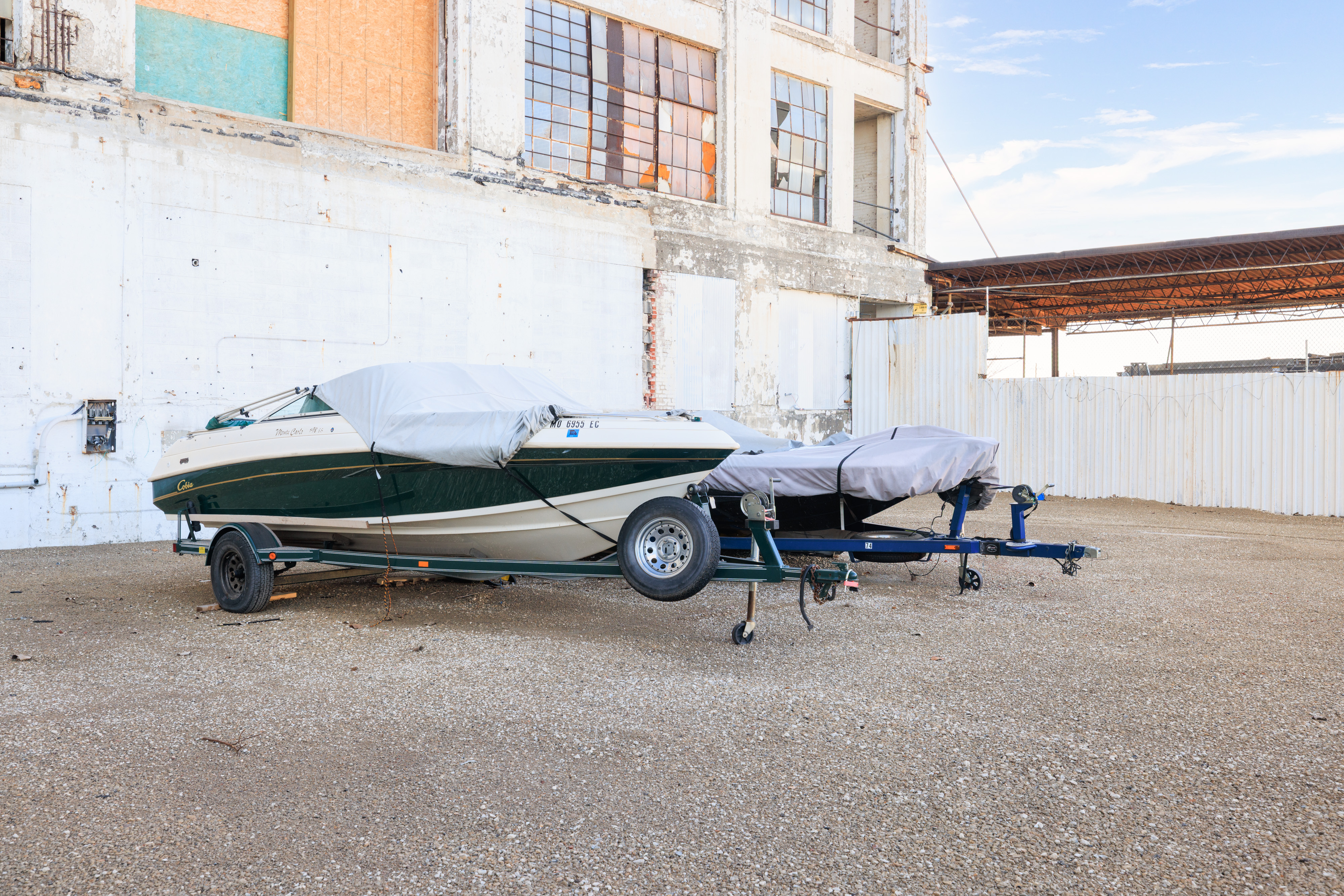 Covered trailers and oversized vehicles in outdoor storage area